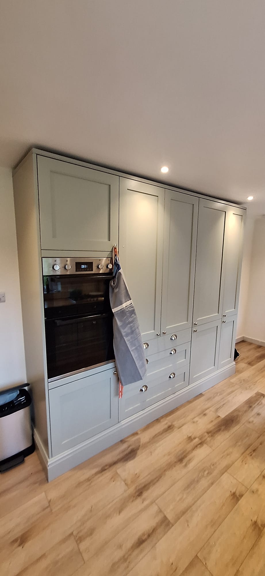 Full-height fitted kitchen pantry and appliance cabinetry